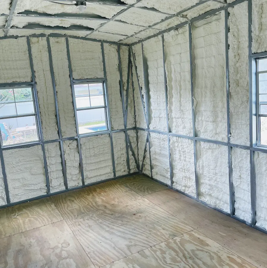 Closed-cell spray foam insulation applied to wall cavities in a residential project in Passaic